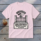 A light pink t-shirt displays a graphic of a wooden porch styled like a Wi-Fi symbol, with text reading "HOLLER WIFI? One bar, if you stand on the porch."