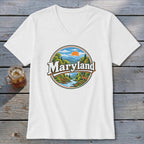 White v-neck t-shirt with circular Maryland landscape graphic featuring a deer and river.