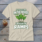 A light beige t-shirt featuring green text reading If You See Me in the Woods I'm Huntin' Ramps above an illustration of three ramp plants.