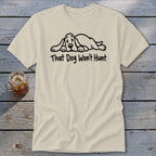 A cream-colored t-shirt with a line drawing of a sleeping dog and the text "That Dog Won't Hunt".