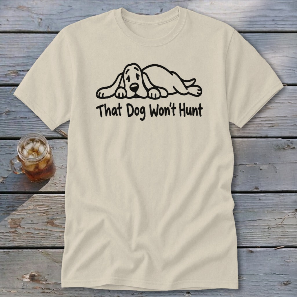 A cream-colored t-shirt with a line drawing of a sleeping dog and the text "That Dog Won't Hunt".