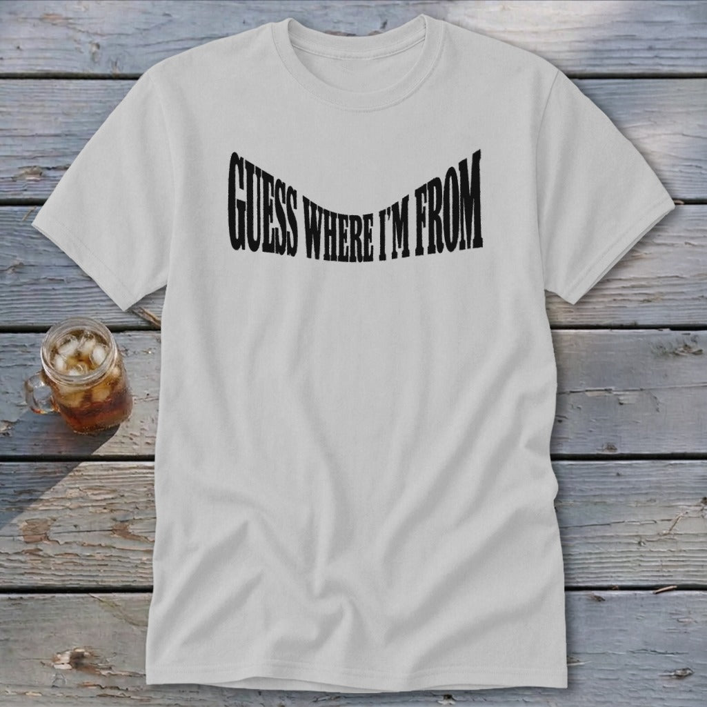 White t-shirt with black text reading "GUESS WHERE I'M FROM"