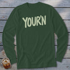 Dark green long sleeve shirt with "YOUR'N" printed in light green lettering.
