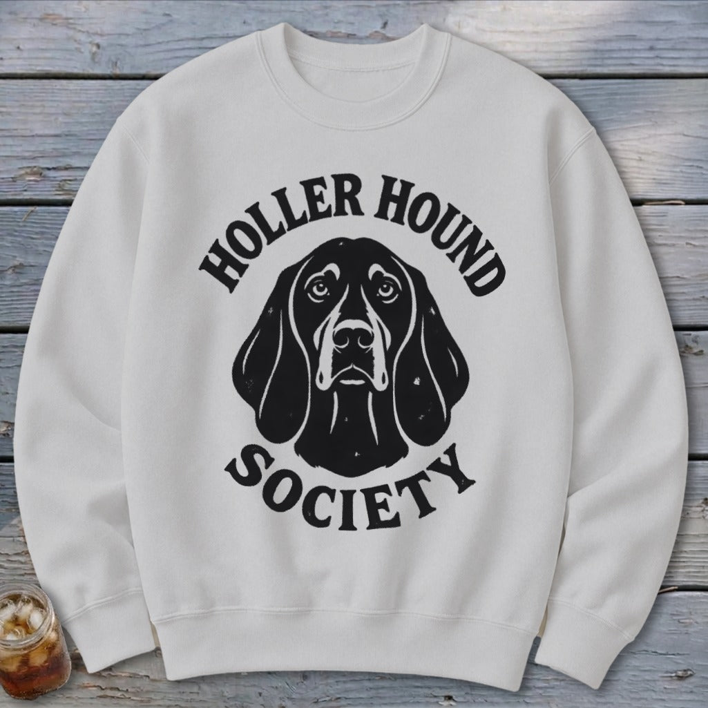 White sweatshirt with black "Holler Hound Society" text and dog illustration.