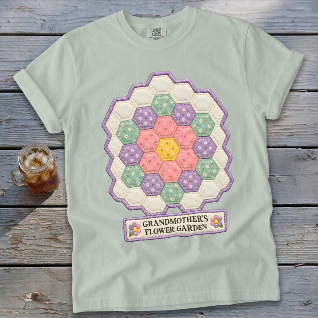 Light green t-shirt with a hexagonal patchwork flower design and "GRANDMOTHER'S FLOWER GARDEN" text.