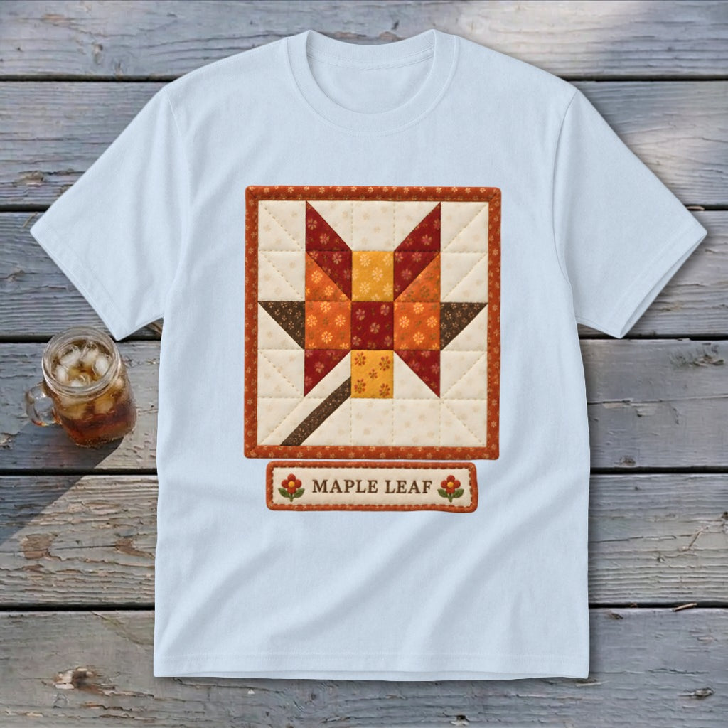 Light blue t-shirt with a quilted maple leaf block design and "MAPLE LEAF" text.