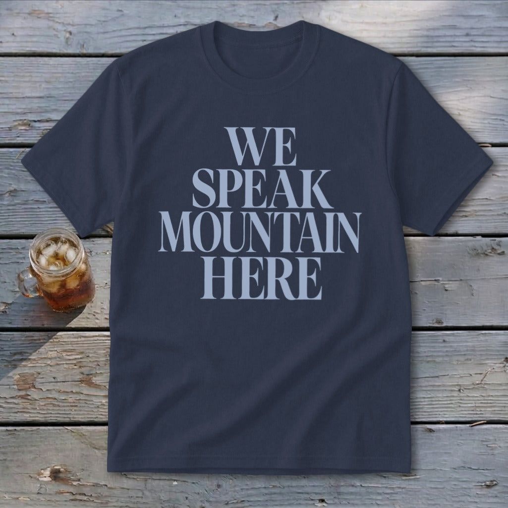 Navy t-shirt with "WE SPEAK MOUNTAIN HERE" in light blue text.
