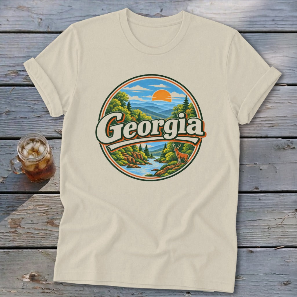 Cream t-shirt with a circular Georgia mountain and river graphic featuring a deer.