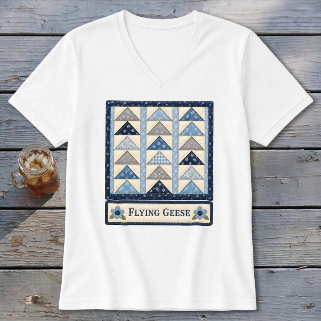 White v-neck t-shirt with a "Flying Geese" quilt block graphic.