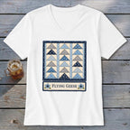 White v-neck t-shirt with a "Flying Geese" quilt block graphic.