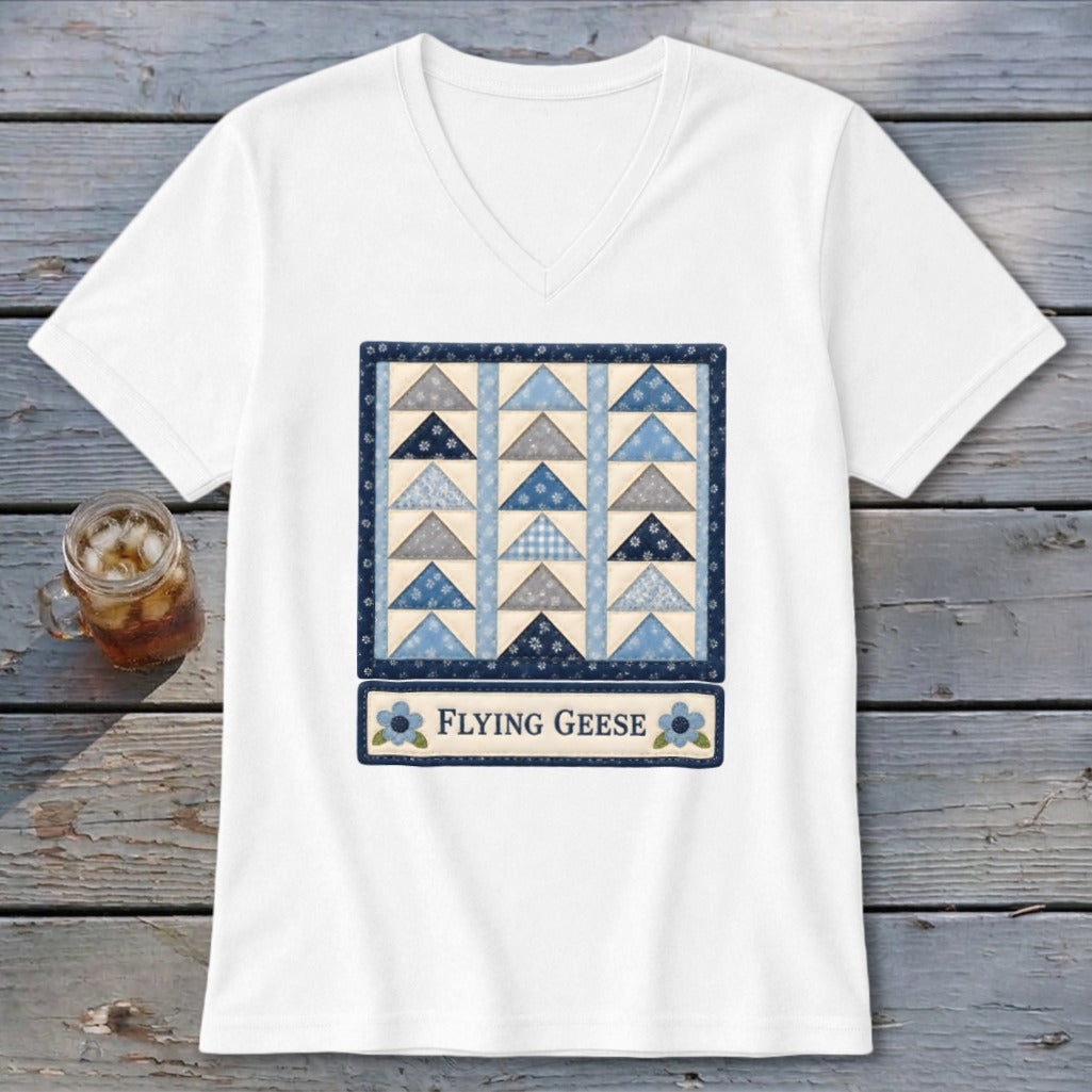 White v-neck t-shirt with a "Flying Geese" quilt block graphic.