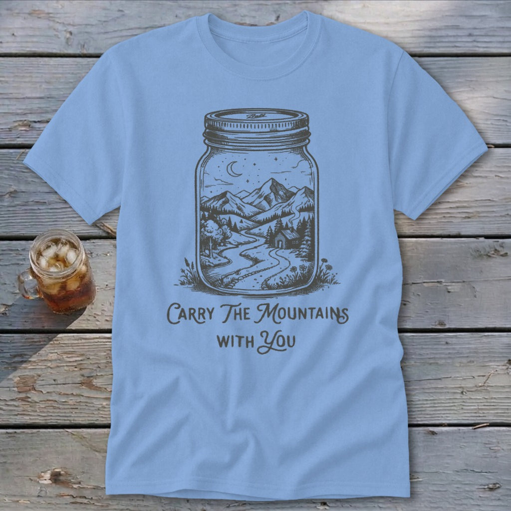 Light blue crewneck t-shirt featuring a mason jar illustration of mountains and the text Carry The Mountains With You.