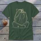 Green t-shirt with a drawing of a bear sitting and playing a harmonica.