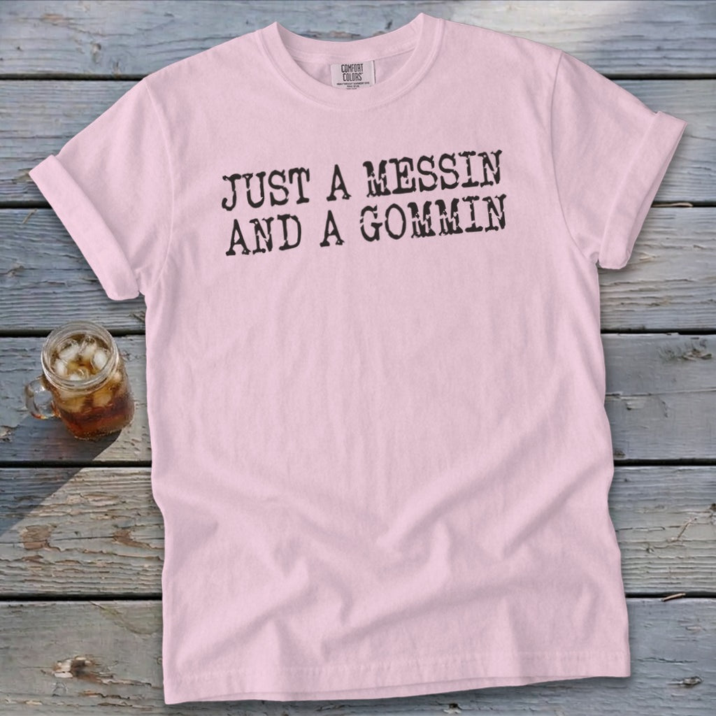 Pink t-shirt with black text reading "JUST A MESSIN AND A GOMMIN".