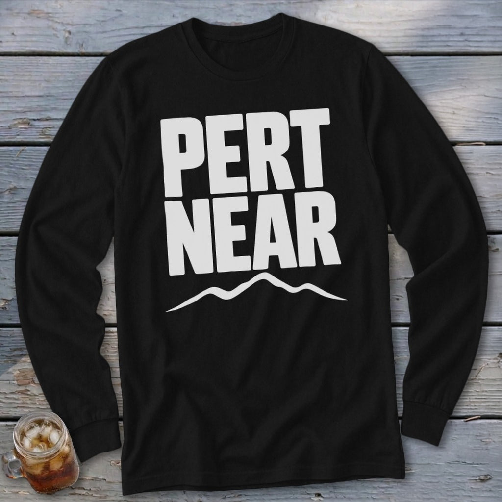 A black long-sleeve t-shirt features white text reading "PERT NEAR" above a simple mountain outline.