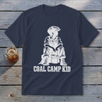 Navy t-shirt with white "Coal Camp Kid" graphic of a boy in overalls and cap.