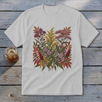 White t-shirt with a colorful floral and leaf print on the chest.