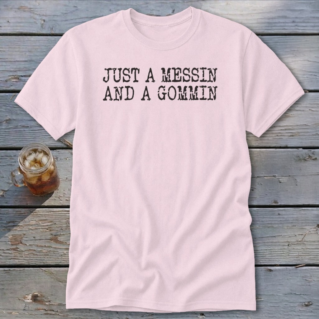 Pink t-shirt with black text reading "JUST A MESSIN AND A GOMMIN".