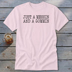 Pink t-shirt with black text reading "JUST A MESSIN AND A GOMMIN".