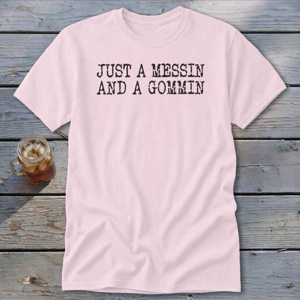 Pink t-shirt with black text reading "JUST A MESSIN AND A GOMMIN".