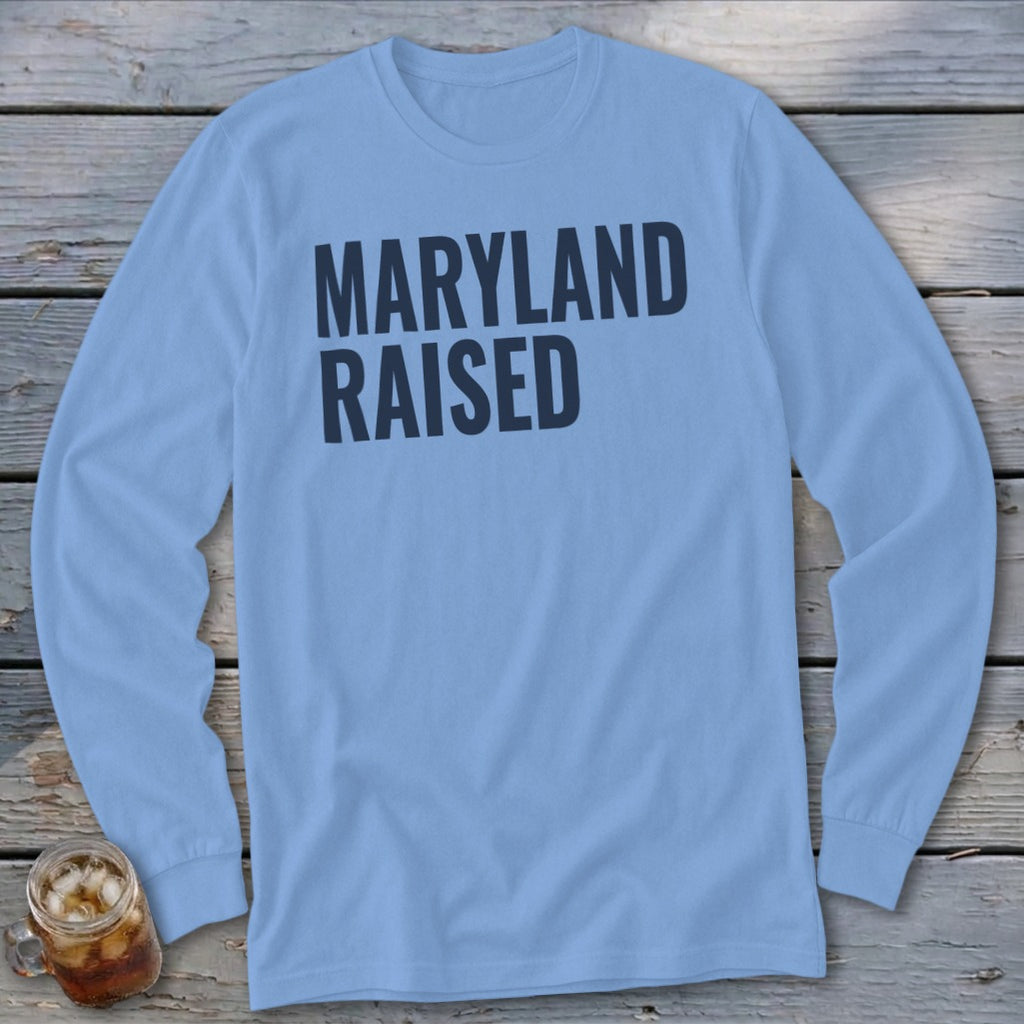 Light blue long-sleeve t-shirt with "MARYLAND RAISED" text in dark blue.