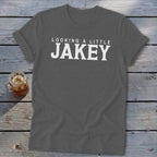 Dark gray t-shirt with white text reading "LOOKING A LITTLE JAKEY".