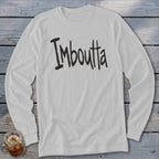 White long-sleeved shirt with black distressed text "Imboutta" and a glass of iced tea.