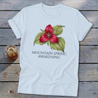 White t-shirt with red trillium flower and text "MOUNTAIN SPRING AWAKENING".