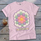 Pink t-shirt with a hexagonal flower quilt design and the text "Grandmother's Flower Garden."