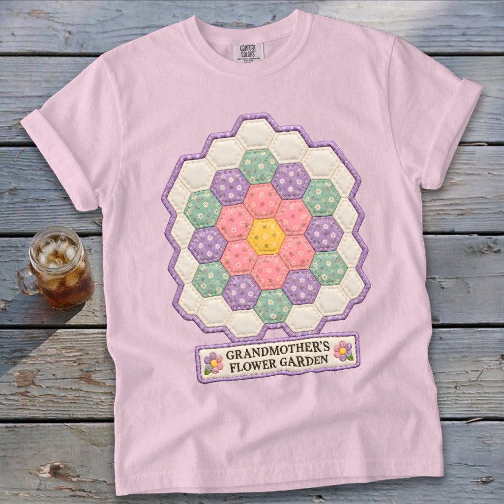 Pink t-shirt with a hexagonal flower quilt design and the text "Grandmother's Flower Garden."