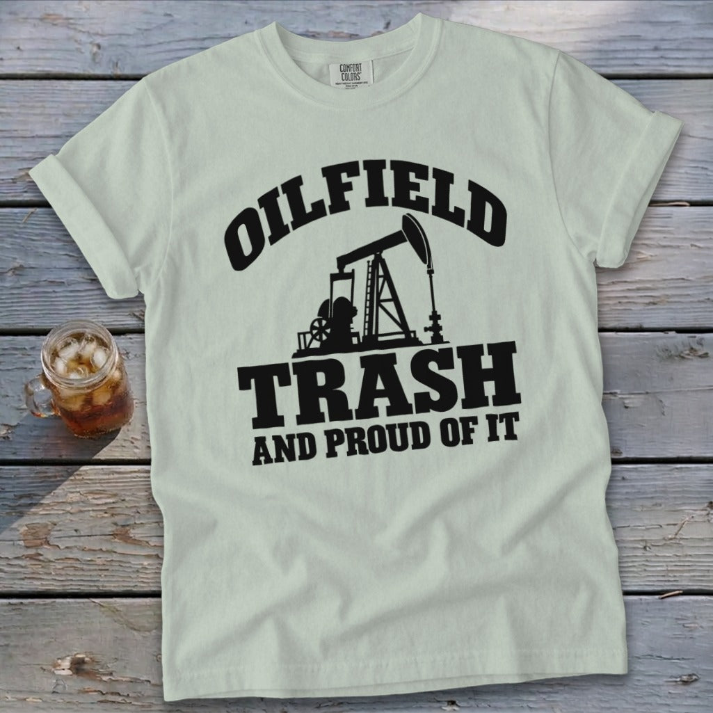 Light green t-shirt with black text and oil pump graphic: "OILFIELD TRASH AND PROUD OF IT".