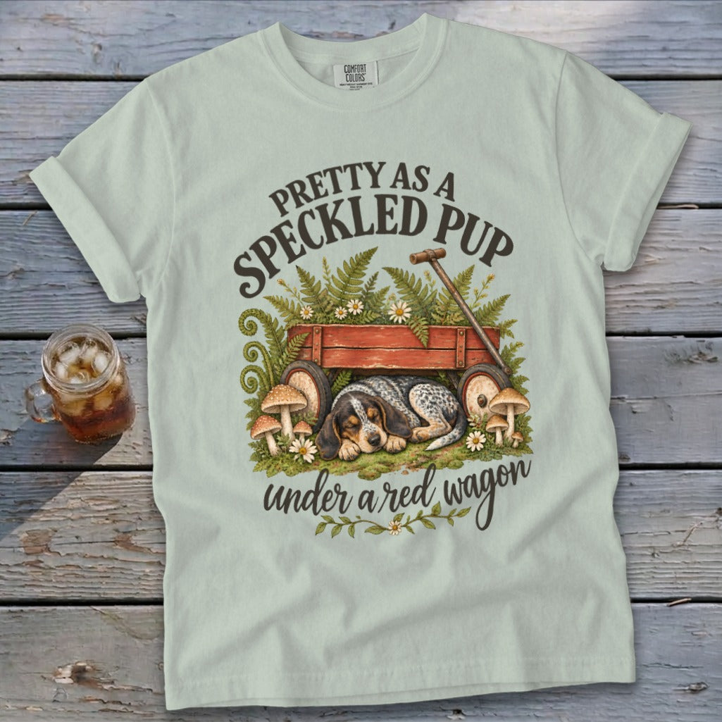 Light green t-shirt with "Pretty as a Speckled Pup under a red wagon" text and dog art.