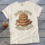 Cream t-shirt with "Dried Apple Stack Cake" text and illustration of a stack cake.