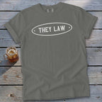 Gray t-shirt with white oval graphic containing "THEY LAW" text.