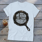 White t-shirt with a cast iron skillet graphic saying "No Sugar In The Cornbread".