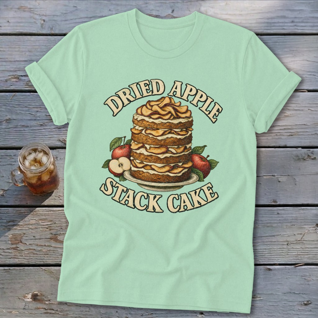 Light green t-shirt with "Dried Apple Stack Cake" design featuring a layered cake and apples.