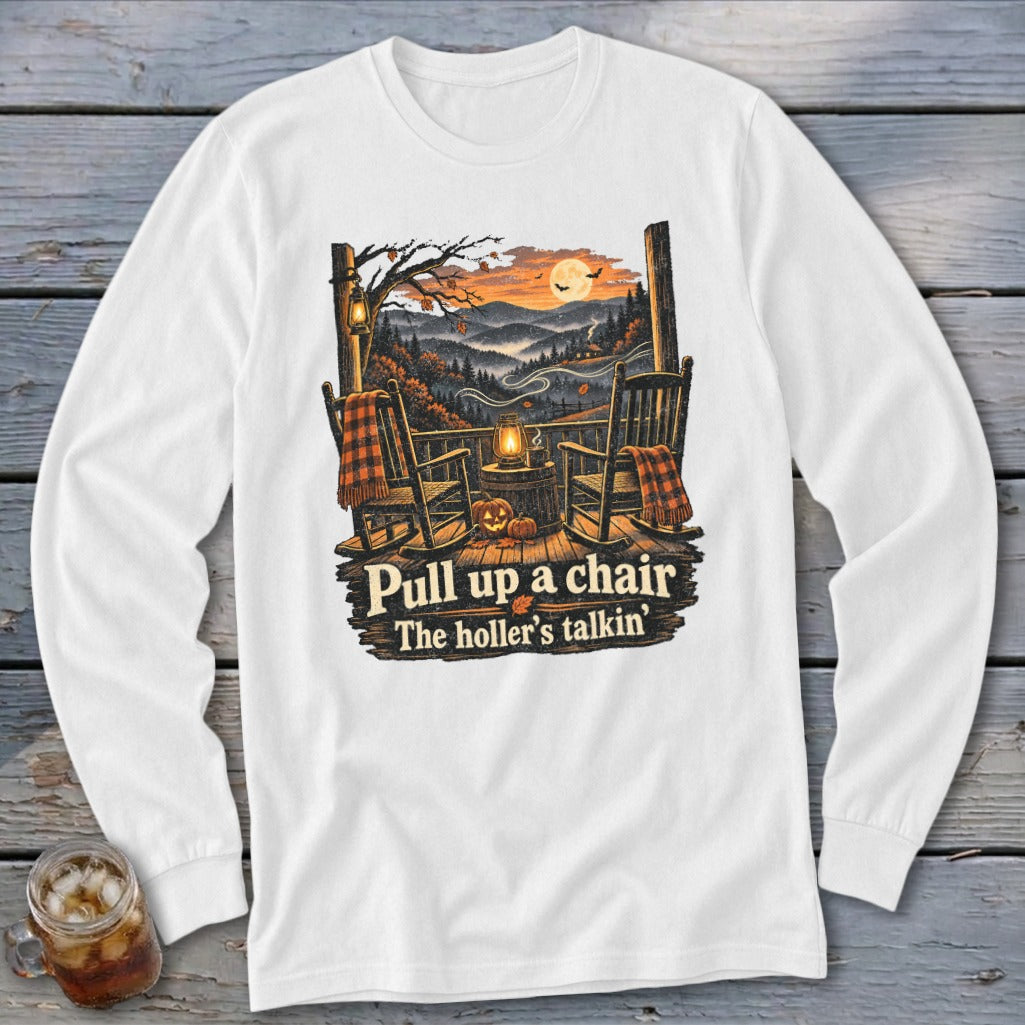 White long sleeve shirt with porch scene, rocking chairs, pumpkins, and text.