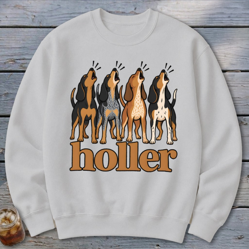Four dogs howling above the text "holler" on a white sweatshirt.