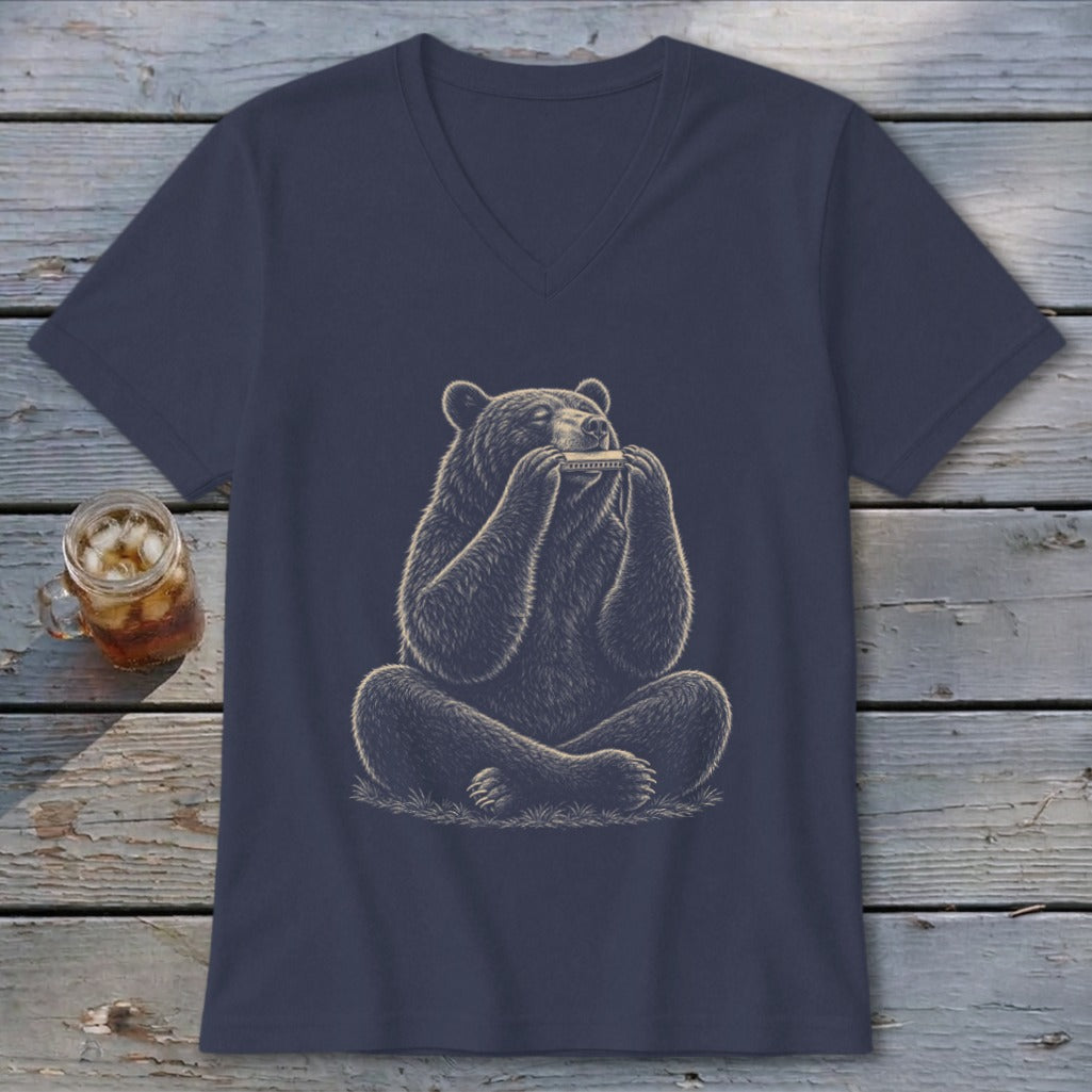 Illustration of a bear sitting cross-legged, playing a harmonica on a t-shirt.