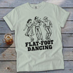 Light green t-shirt with "FLAT-FOOT DANCING" and a fiddle player, dancer, and cowboy.