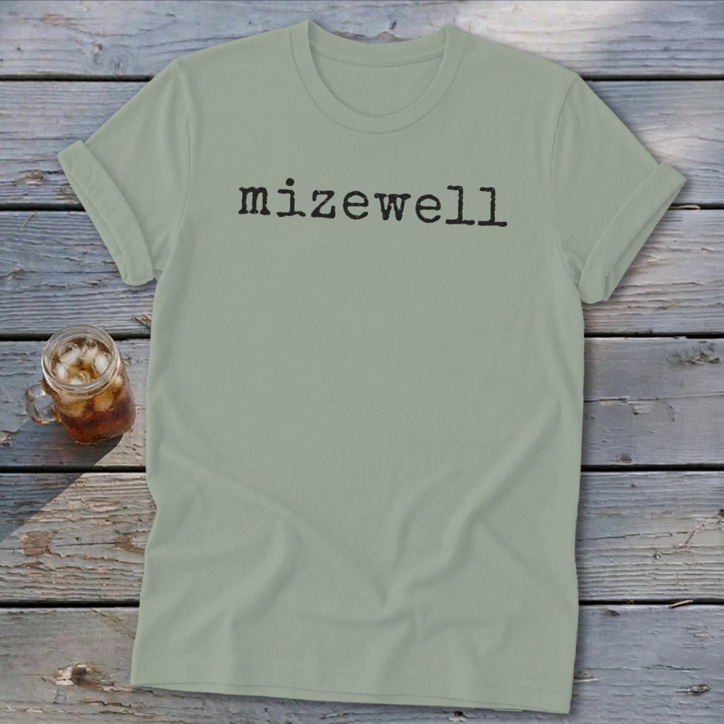 Light green t-shirt with "mizewell" in black typewriter font.