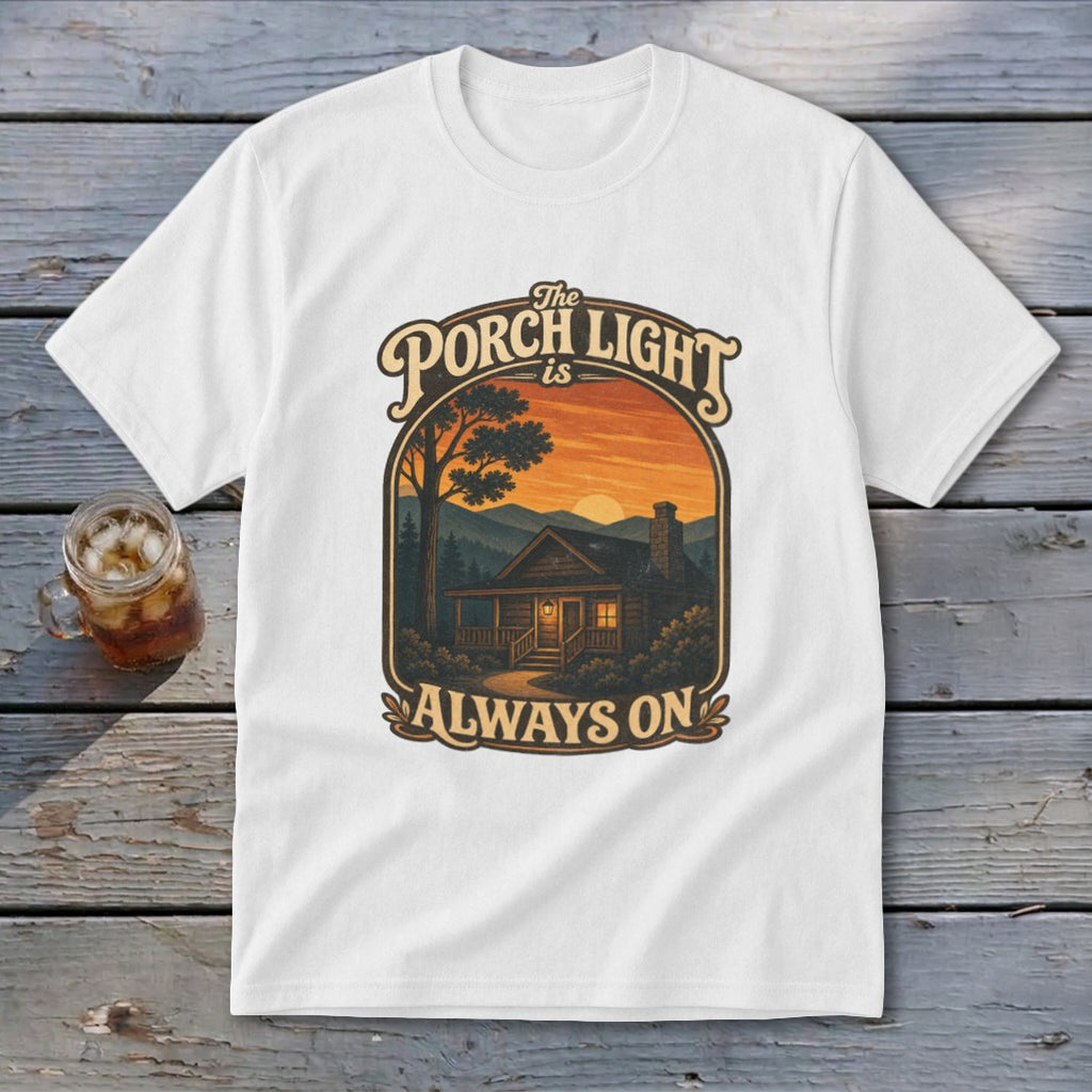 White t-shirt with graphic "The Porch Light is Always On" and a cabin scene.