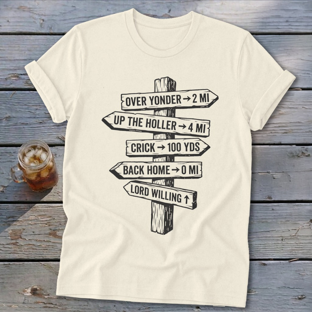 An off-white short-sleeve t-shirt featuring a black graphic of a rustic wooden signpost with humorous directional distances.