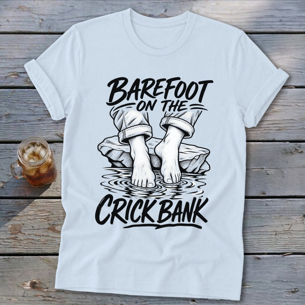 Light blue t-shirt with "Barefoot on the Crick Bank" graphic.