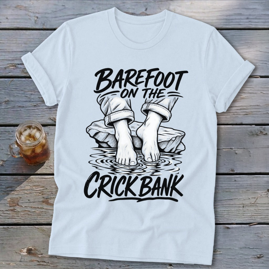 Light blue t-shirt with "Barefoot on the Crick Bank" graphic.