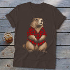 Groundhog wearing a red and black plaid shirt sitting on a brown t-shirt.