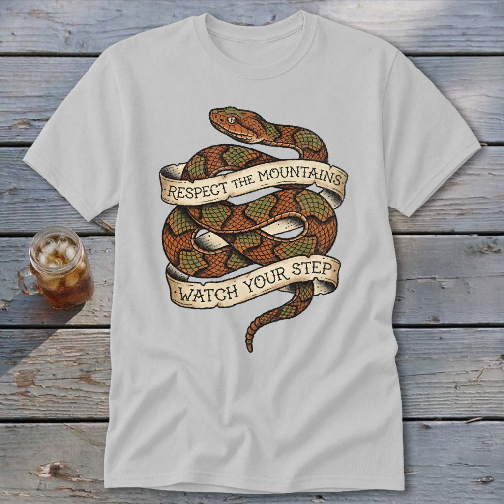 T-shirt with coiled snake graphic and text "RESPECT THE MOUNTAINS WATCH YOUR STEP".