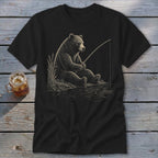 Black t-shirt graphic of a bear fishing by the water.