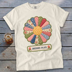 White t-shirt with a Dresden Plate quilt-style flower graphic and "DRESDEN PLATE" text.