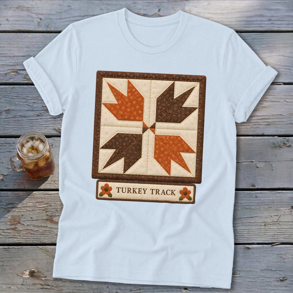 Light blue t-shirt with a "Turkey Track" quilt block design and text.